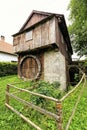 Historic saw-mill house with broken wheel Royalty Free Stock Photo