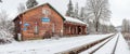 Historic single-track train station covered with fresh snow Royalty Free Stock Photo