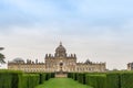 Historic stately home of Castle Howard with Atlas fountain in parterre gardens.