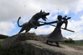 Historic statue of farm girl fighting giant wolf the Beast of Geveaudan in France