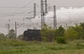 Historic steam locomotive with passenger wagons on rail tracks