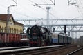 Historic steam locomotive at train station