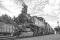 Historic steam powered railway train in black and white Royalty Free Stock Photo