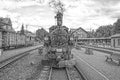 Historic steam powered railway train in black and white
