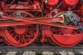 Historic steam train - Close-up of the red wheels on the railway tracks Royalty Free Stock Photo