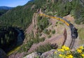 A steam train along a river in Colorado Royalty Free Stock Photo