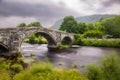 Historic steep stone arch bridge crossing a river - Pont Fawr (Inigo Jones Bridge) Llanrwst Royalty Free Stock Photo