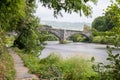 Historic steep stone arch bridge crossing a river - Pont Fawr (Inigo Jones Bridge) North Wales Royalty Free Stock Photo