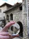 Glass ball and old stone house view