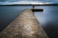 Historic stone jetty on Loch Leven, Scotland.