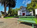 Historic stone library building and a street bench in Greytown New Zealand