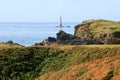 Historic stone lighthouse on offshore rock