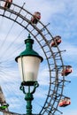 A historic street lantern in front of the Giant Ferris Wheel at Prater Park, Vienna Royalty Free Stock Photo