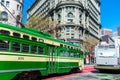 Historic streetcar 1051 and SFTMA bus ride on Market Street in downtown - San Francisco, California, USA - February, 2020