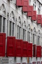 Historic tall grey building with red windows, street view in Utrecht, Netherlands Royalty Free Stock Photo