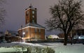 Historic telegraph building in Brake Unterweser, Germany during a snowy winter night - seen from the `Kaje`