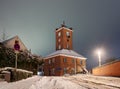 Historic telegraph building in Brake Unterweser, Germany during a snowy winter night - seen from the street