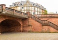 Historic tenement house in Frankfurt. Crossing the street. A small viaduct. Historical object. Stone stairs and balustrades. Royalty Free Stock Photo