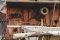 Historic threshing machine in operation. In the foreground is a historic wooden cart for the mown wheat Royalty Free Stock Photo