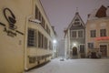 Historic Town Hall Pharmacy and other buildings in Olt Tallinn during heavy snowfall Royalty Free Stock Photo