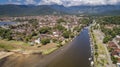 Aerial view to river Pereque-Acu in historic town Paraty with green mountains covered with white clouds in background, Unesco Royalty Free Stock Photo