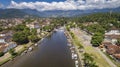 Close-up aerial view to river Pereque-Acu in historic town Paraty with green mountains covered with white clouds in background, Royalty Free Stock Photo