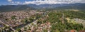 Panoramic aerial view to historic town Paraty and river, green mountains and white clouds in background, Unesco World Heritage, Royalty Free Stock Photo