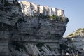 Historic town on a white cliff overlooking the sea in the port of Bonifacio