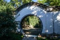 Historic traditional Chinese moon gate of Beijing at sunny day in summer