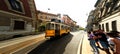 A historic tram in Milan, Italy artistically distorted blurred extra wide panorama