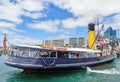 Historic tugboat leaving on harbor cruise, Auckland, New Zealand Royalty Free Stock Photo