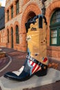 Historic Union Pacific Railroad train depot, a historic landmark, and it statue and boot adornments in Cheyenne, Wyoming