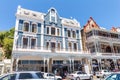 Historic Victorian buildings in Simons Town with sidewalk coffee shops in Western Cape South Africa