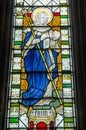 Stained glass window showing the virtue Faith