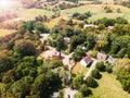 Historic village near Washington. Roads and roofs of houses surrounded by greenery. View from a drone