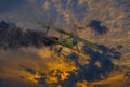 Historic vintage biplane propeller with engine on fire and smoke before crash in dramatic sunset sky. Military reconnaissance Royalty Free Stock Photo