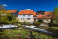 Historic water mill in Buchfart on the Ilm river near Weimar with a water weir Royalty Free Stock Photo