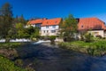 Historic water mill in Buchfart on the Ilm river near Weimar with water weir Royalty Free Stock Photo