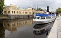 Historic Water-pump Building and the excursion tourist boat on the Fyris River, Uppsala, Sweden