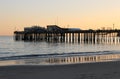 Silhouette of Capitola Wharf at sunset.