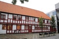 Historic white and red painted timbered building in the city center, Aalborg, Denmark Royalty Free Stock Photo