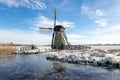 Historic windmill on the frozen lake Kagerplassen in Warmond Royalty Free Stock Photo