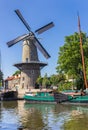 Historic windmill De Roode Leeuw in the harbor of Gouda