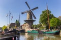 Historic windmill De Roode Leeuw in the harbor of Gouda Royalty Free Stock Photo