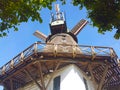 Historic windmill in front of blue sky Royalty Free Stock Photo