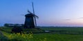 Historic windmill near Schemerhorn in the Netherlands under evening light Royalty Free Stock Photo