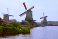 Historic windmills at river, Zaanse Schans, Netherlands Royalty Free Stock Photo