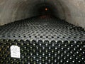 Historic wine bottles in the Taittinger Champagne House Vault in Reims, France