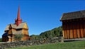 Historic wood stave church in brigth morning sunlight with clear blue sky
