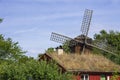 Wooden Hut And Windmill Royalty Free Stock Photo